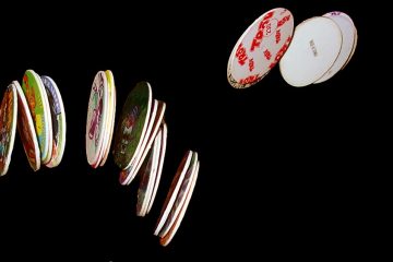 Pogs (small discs of cardboard with an image on one side) flying through the air