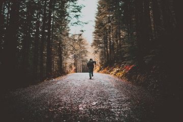 person running on dirt road